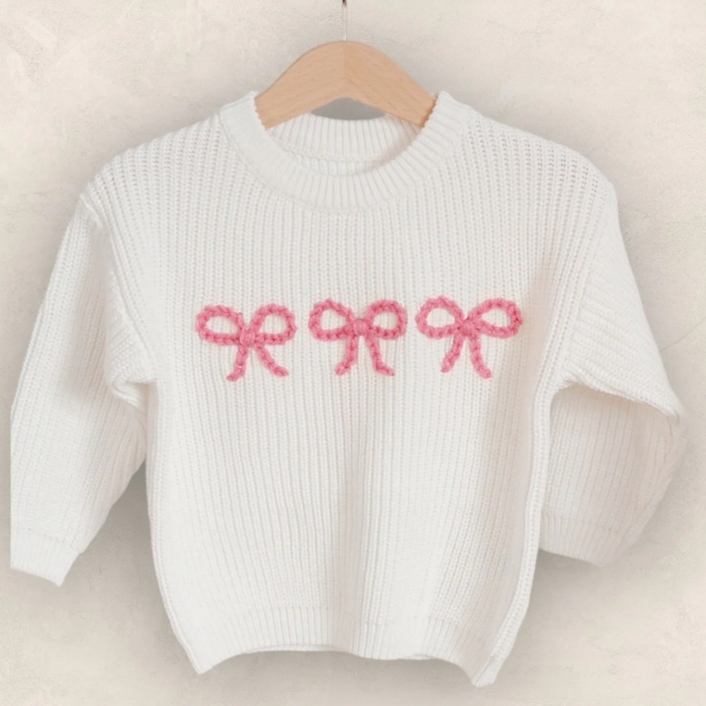 Elegant White Sweater with Pink Bow Details